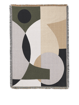 Entire Tapestry Blanket with abstract circle pattern in green, beige, black and grey, fringed edges
